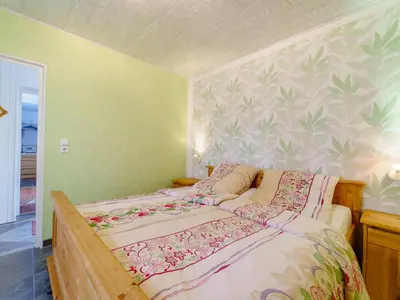 Ein Bett oder Betten in einem Zimmer der Unterkunft Ferienwohnungen im Deichweg