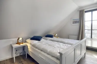 Ein Bett oder Betten in einem Zimmer der Unterkunft Sanya