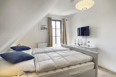 Ein Bett oder Betten in einem Zimmer der Unterkunft Sanya