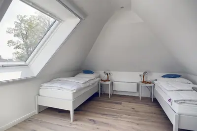 Ein Bett oder Betten in einem Zimmer der Unterkunft Sanya
