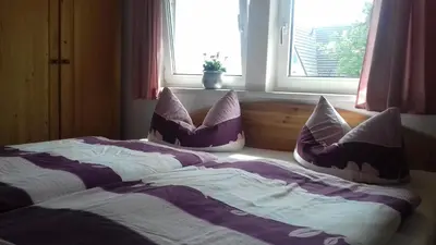 Ein Bett oder Betten in einem Zimmer der Unterkunft Meyers Ausguck