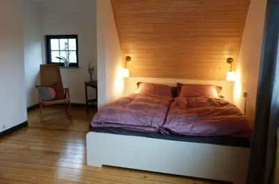 Ein Bett oder Betten in einem Zimmer der Unterkunft Darßer Strandgut - Haus Butzek