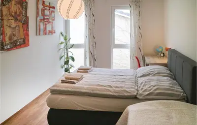 Ein Bett oder Betten in einem Zimmer der Unterkunft 2 Bedroom Beautiful Apartment In Barth