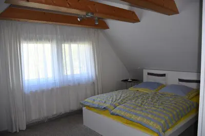 Ein Bett oder Betten in einem Zimmer der Unterkunft Ostseebrise 1