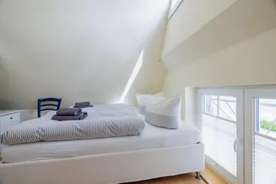 Ein Bett oder Betten in einem Zimmer der Unterkunft Haus Möwe