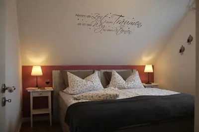 Ein Bett oder Betten in einem Zimmer der Unterkunft Ferienwohnung Abendsonne