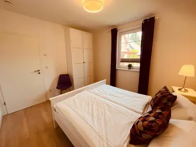 Ein Bett oder Betten in einem Zimmer der Unterkunft Ferienwohnung Art in Born