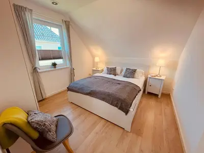 Ein Bett oder Betten in einem Zimmer der Unterkunft Ferienwohnung Country