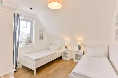 Ein Bett oder Betten in einem Zimmer der Unterkunft Ferienwohnung Harmonie in Born