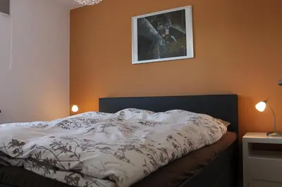 Ein Bett oder Betten in einem Zimmer der Unterkunft Ferienwohnung de Windroos