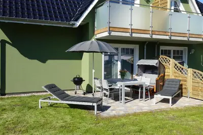 Ein Garten an der Unterkunft Ferienwohnung de Windroos