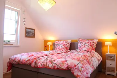 Ein Bett oder Betten in einem Zimmer der Unterkunft Ferienwohnung Ostwind in Born