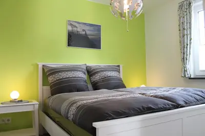Ein Bett oder Betten in einem Zimmer der Unterkunft Ferienwohnung Perlentaucher
