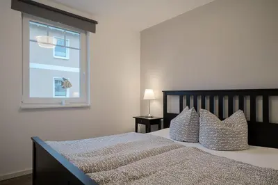 Ein Bett oder Betten in einem Zimmer der Unterkunft Ferienwohnung van der Holm