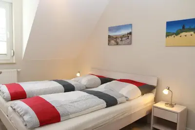 Ein Bett oder Betten in einem Zimmer der Unterkunft Ferienwohnung Strandaster