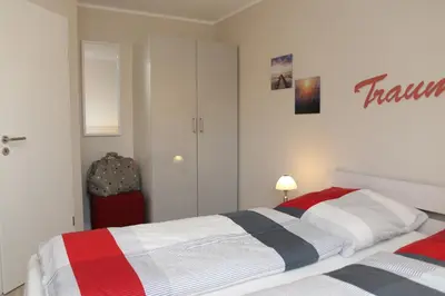 Ein Bett oder Betten in einem Zimmer der Unterkunft Ferienwohnung Strandaster