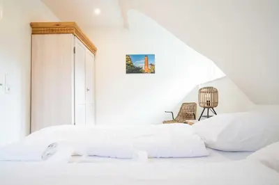 Ein Bett oder Betten in einem Zimmer der Unterkunft Traumgarten - Haus Abendsonne