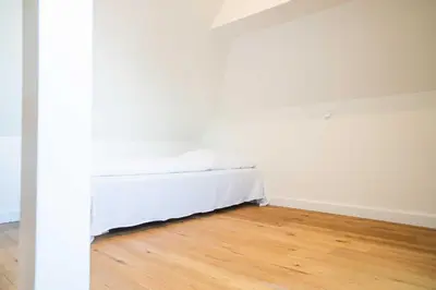 Ein Bett oder Betten in einem Zimmer der Unterkunft Traumgarten - Haus Abendsonne