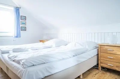 Ein Bett oder Betten in einem Zimmer der Unterkunft Haus Alte Bäckerei - Boddenblick