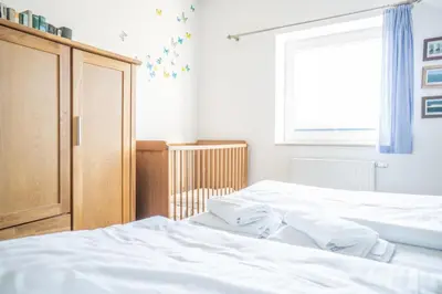 Ein Bett oder Betten in einem Zimmer der Unterkunft Haus Alte Bäckerei - Boddenblick