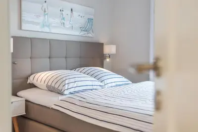 Ein Bett oder Betten in einem Zimmer der Unterkunft Whg 12 Viktoria Luna Ostseeflair