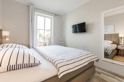 Ein Bett oder Betten in einem Zimmer der Unterkunft Whg 12 Viktoria Luna Ostseeflair