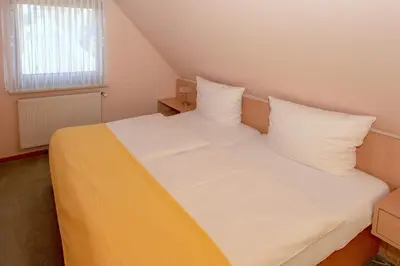 Ein Bett oder Betten in einem Zimmer der Unterkunft Meereslust OG 3R