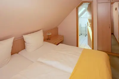 Ein Bett oder Betten in einem Zimmer der Unterkunft Meereslust OG 3R