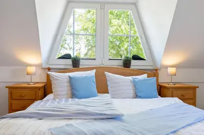 Ein Bett oder Betten in einem Zimmer der Unterkunft Alte Reihe 14 