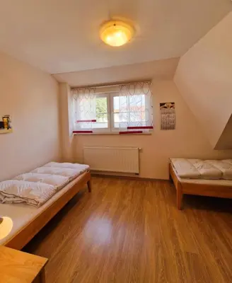 Ein Bett oder Betten in einem Zimmer der Unterkunft Strandstr.