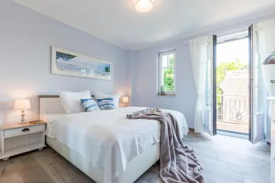 Ein Bett oder Betten in einem Zimmer der Unterkunft Sonne und Meer