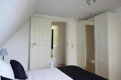 Ein Bett oder Betten in einem Zimmer der Unterkunft Reethaus Ostseestrand 15