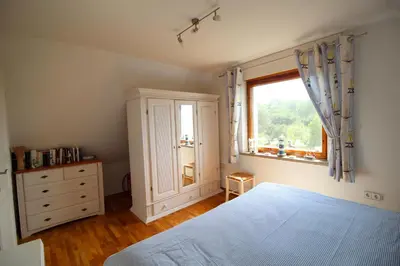 Ein Bett oder Betten in einem Zimmer der Unterkunft Reethaus Ostseestrand 18