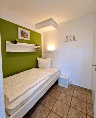 Ein Bett oder Betten in einem Zimmer der Unterkunft Hägerende 10/ Wohng.2 