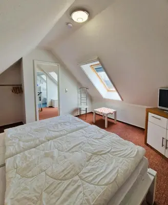 Ein Bett oder Betten in einem Zimmer der Unterkunft 