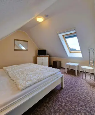 Ein Bett oder Betten in einem Zimmer der Unterkunft Neue Liebe Wohng.4