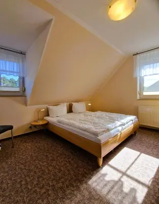 Ein Bett oder Betten in einem Zimmer der Unterkunft Neue Liebe Wohng.4