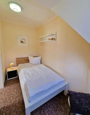 Ein Bett oder Betten in einem Zimmer der Unterkunft Neue Liebe Wohng.4