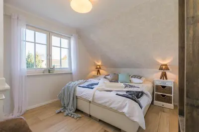Ein Bett oder Betten in einem Zimmer der Unterkunft Rosenbergsiedlung 