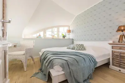 Ein Bett oder Betten in einem Zimmer der Unterkunft Rosenbergsiedlung 