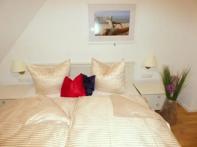 Ein Bett oder Betten in einem Zimmer der Unterkunft Lindenstrasse Haus Sonnenrose