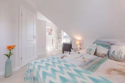 Ein Bett oder Betten in einem Zimmer der Unterkunft Birkmaase 1 a 