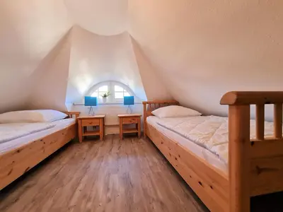 Ein Bett oder Betten in einem Zimmer der Unterkunft Am Paalen