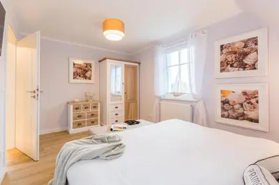Ein Bett oder Betten in einem Zimmer der Unterkunft Barther Str.10 