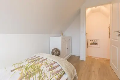 Ein Bett oder Betten in einem Zimmer der Unterkunft Barther Str.10 
