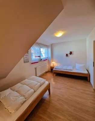 Ein Bett oder Betten in einem Zimmer der Unterkunft Strandstr.