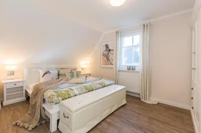 Ein Bett oder Betten in einem Zimmer der Unterkunft Barther Str.10 a Austernfischer