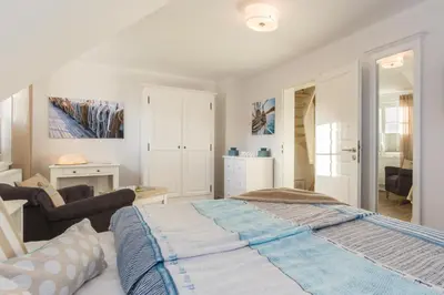 Ein Bett oder Betten in einem Zimmer der Unterkunft Barther Str.10 a Austernfischer