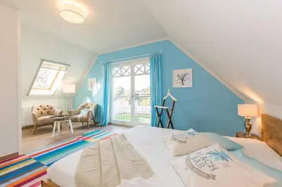 Ein Bett oder Betten in einem Zimmer der Unterkunft Buten un Binnen