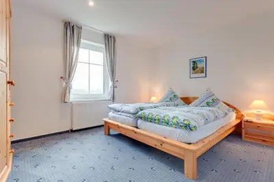 Ein Bett oder Betten in einem Zimmer der Unterkunft Am Ostseestrand 1
